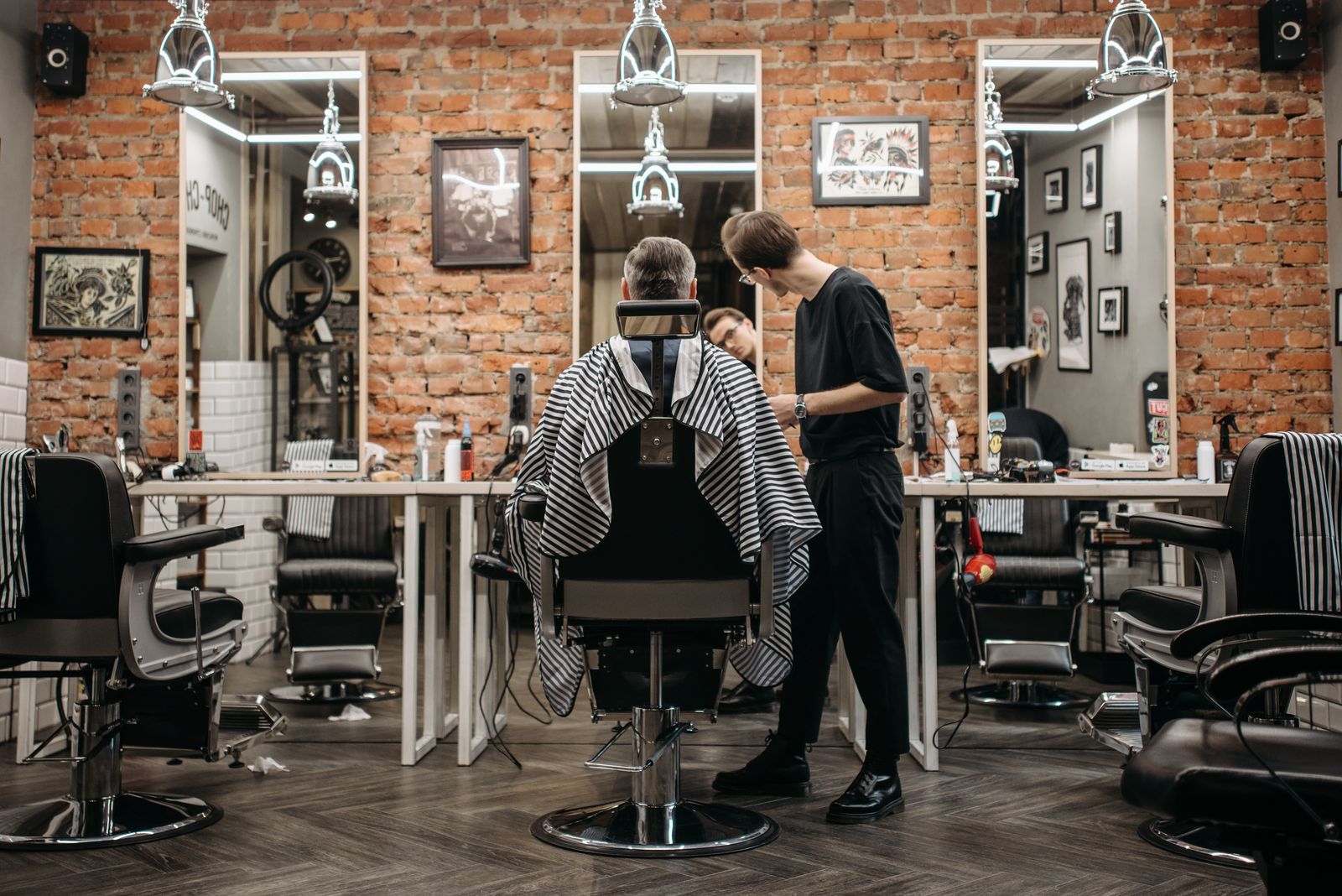 Local barbershop owner at work - free revenue leak tools for local businesses