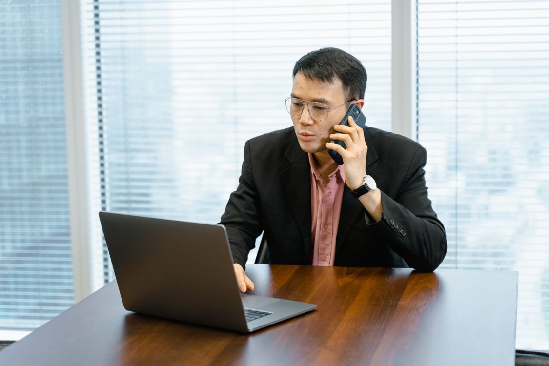 Small business owner answering his business phone - missed call text back service